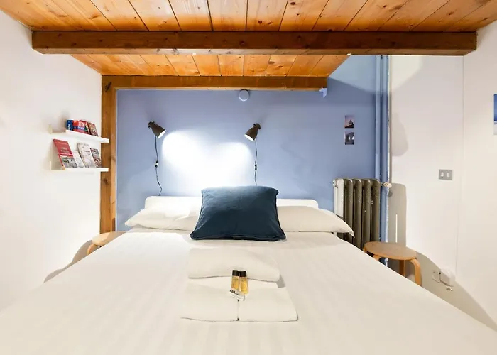 Apartmán Guesthost - Cosy Nest Isola District Heart