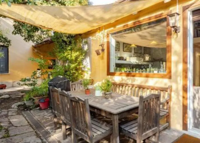 Tiny House On Water Surrounded By Greenery